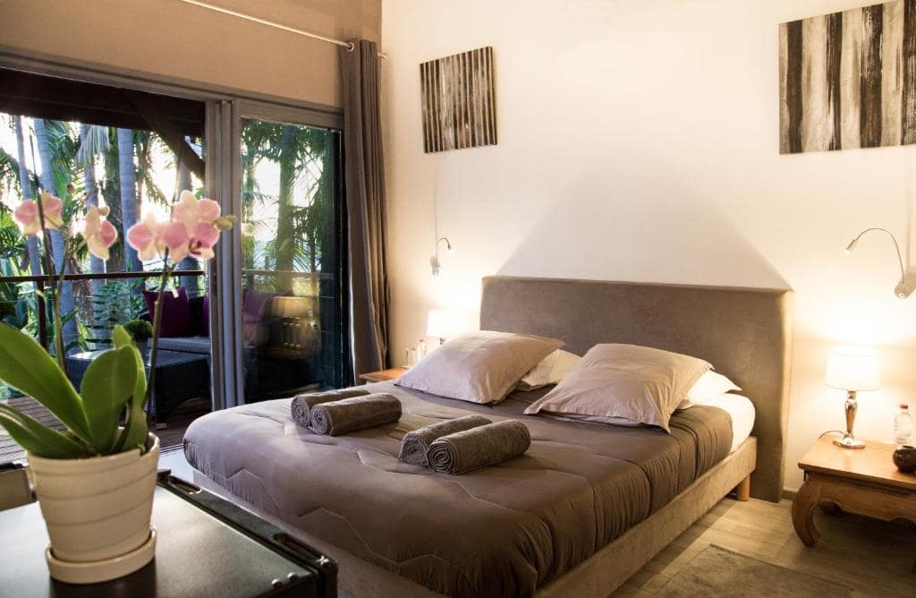 Chambre haut de gamme, orchidée et accès balcon privatif · © Lodge Palmae