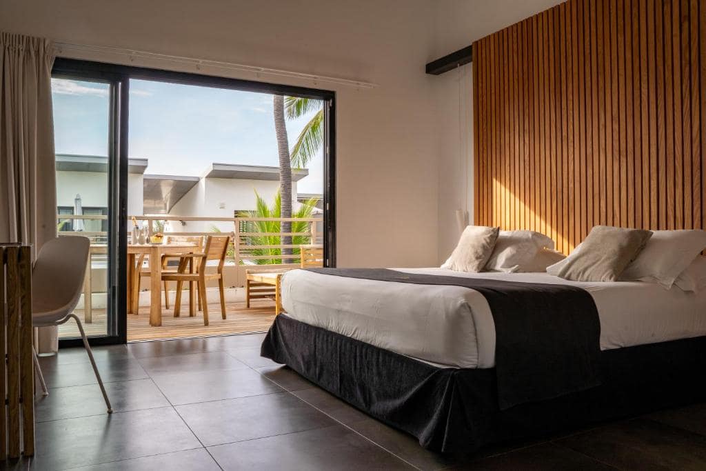 Chambre avec balcon vue palmiers · © Ness by D-Ocean